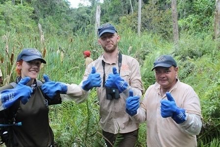 Chester Zoo team with their thumbs up in the field in Madagascar