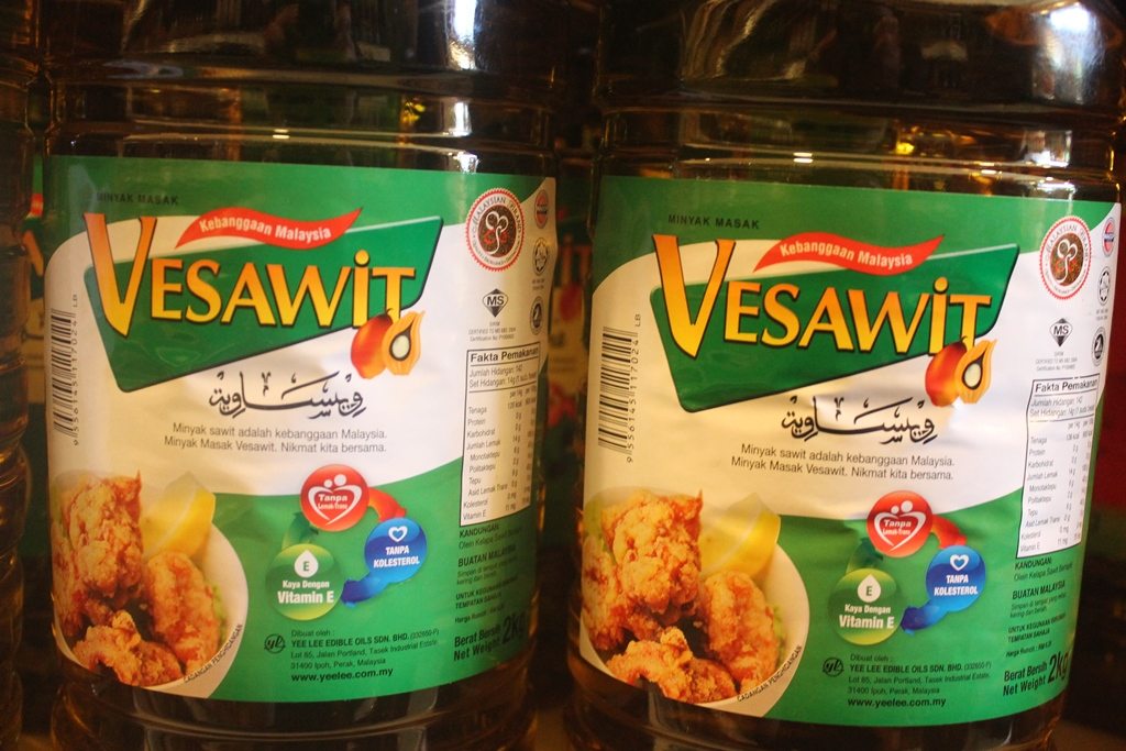 Two bottles of palm oil in local shop in Borneo