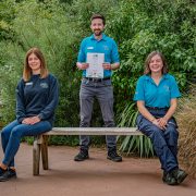 Amy Humphreys, Ian Hickey and Jessamine Smith pictured at Chester Zoo with their BIAZA award