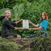 Josh Styles and Helen Bradshaw pictured at Chester Zoo with their BIAZA award