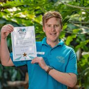 Stuart Young pictured at Chester Zoo with his BIAZA award