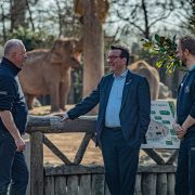 Three men pictured having a conversation at Chester Zoo