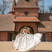 Bride spinning in dress in courtyard of The Square