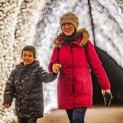 A mother and her young son walk through the Winter Cathedral at Chester Zoo's Lanterns and Light