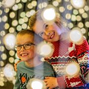 Two young children are pictured in the Winter Cathedral at Chester Zoo's Lanterns and Light