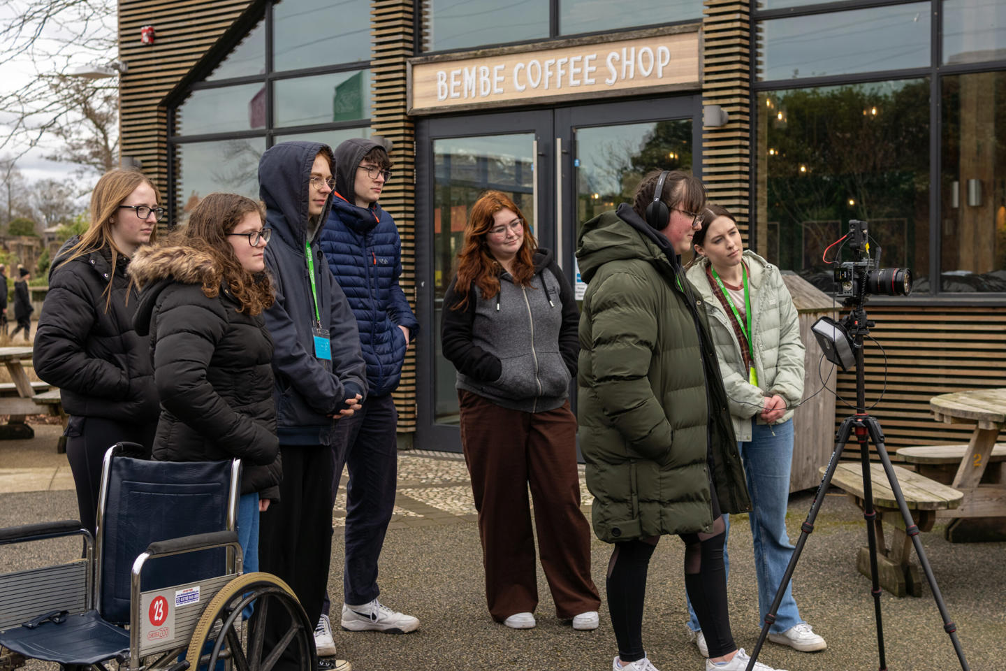 Photo shows a group of young people video and audio recording speakers Bembe restaurant at the zoo