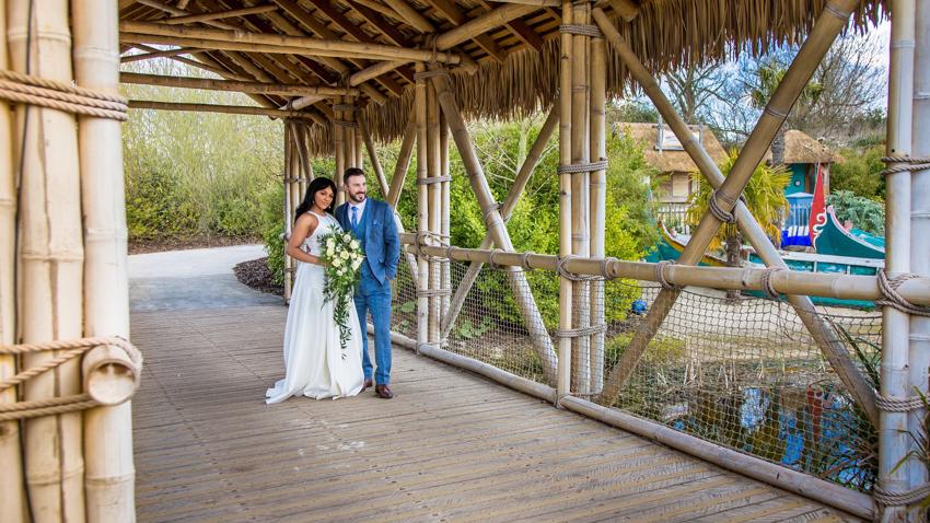 Bride And Groom Standing On A Bridge At Islands