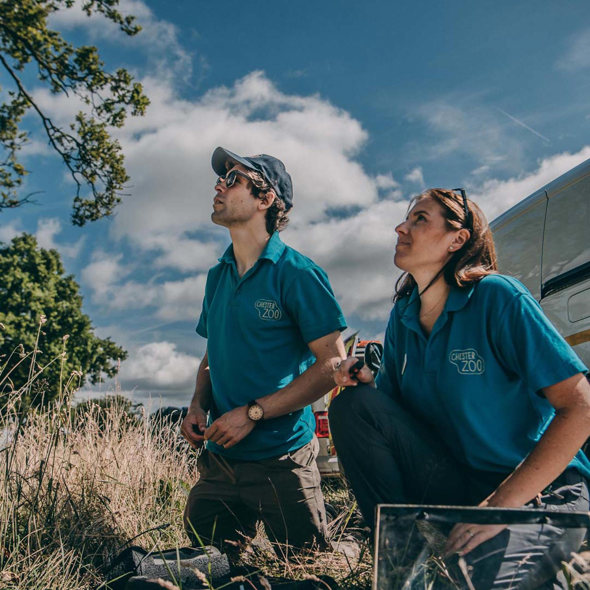 Two Zoo Conservationists Looking Up SQUARE